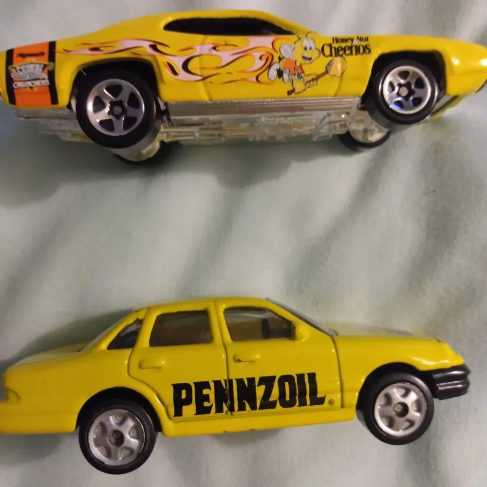 2002 Golden Wheel and 2004 Hot Wheels car